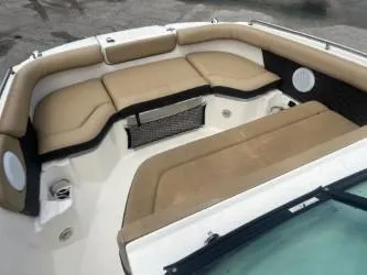 Slide: The Image of 2022 Sea Ray SDX 250 boat interior with beige seating and modern design. - 7