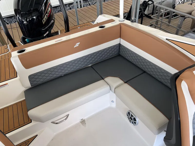 Slide: The Image of 2026 Starcraft SVX 231 OB boat interior with cushioned seating and modern design. - 12