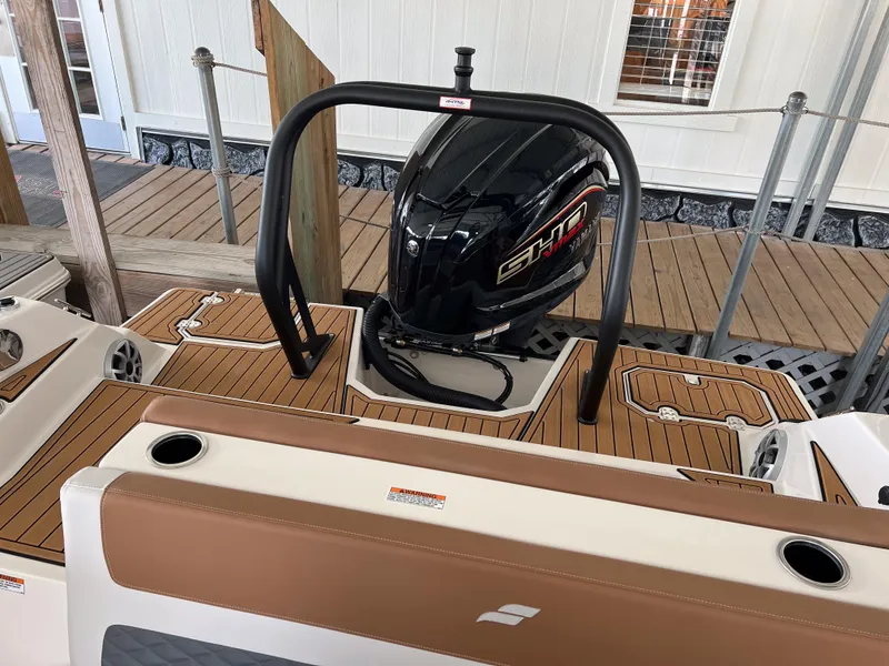 Slide: The Image of 2026 Starcraft SVX 231 OB boat with sleek design and modern outboard motor. - 13