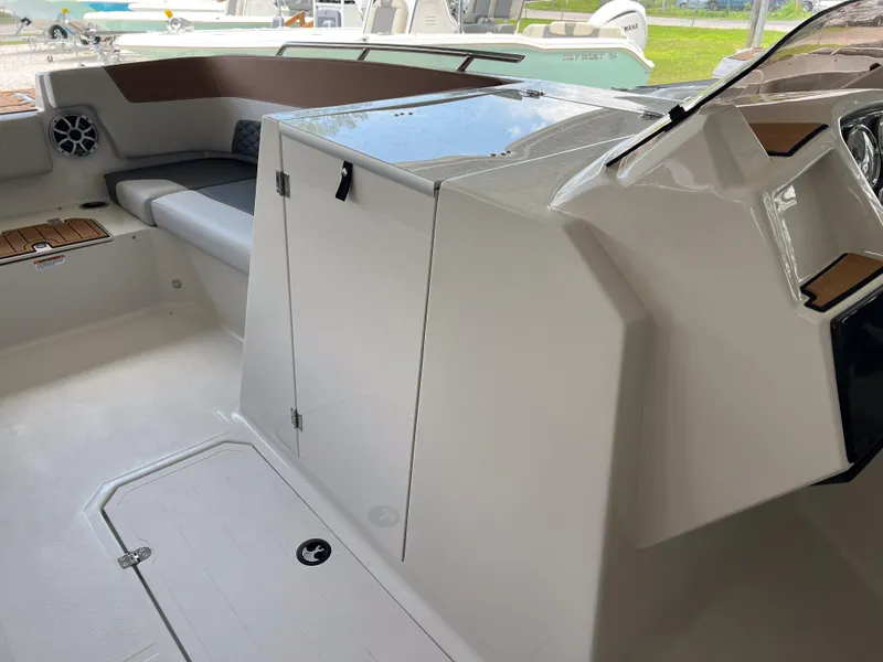 Slide: The Image of Interior of 2026 Starcraft SVX 231 OB boat, featuring seating and storage compartments. - 15
