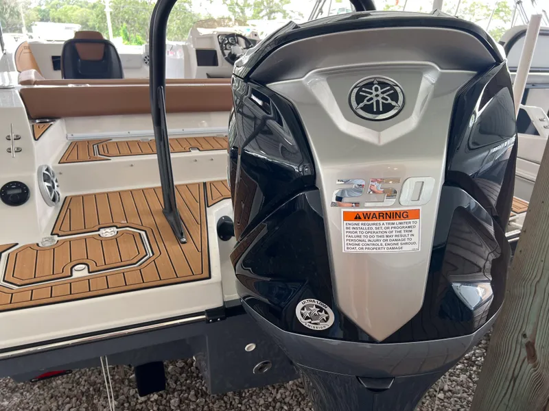 Slide: The Image of 2026 Starcraft SVX 231 OB boat with Yamaha 250 outboard engine, featuring teak-style decking. - 4