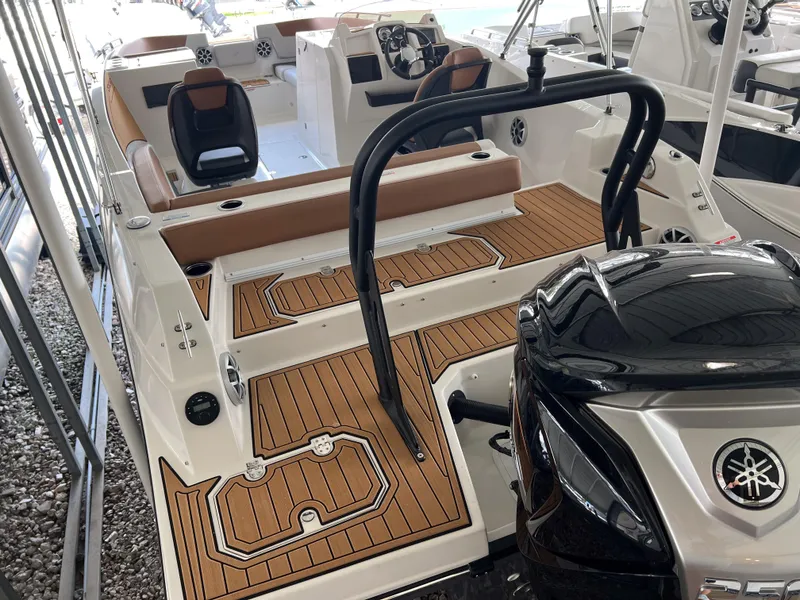 Slide: The Image of 2026 Starcraft SVX 231 OB boat with Yamaha engine, featuring sleek design and spacious seating. - 5