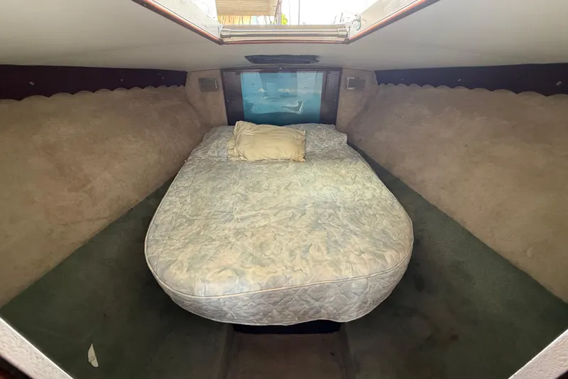 Slide: The Image of Cozy cabin interior of 1984 Custom 38 boat with bed and pillow. - 12