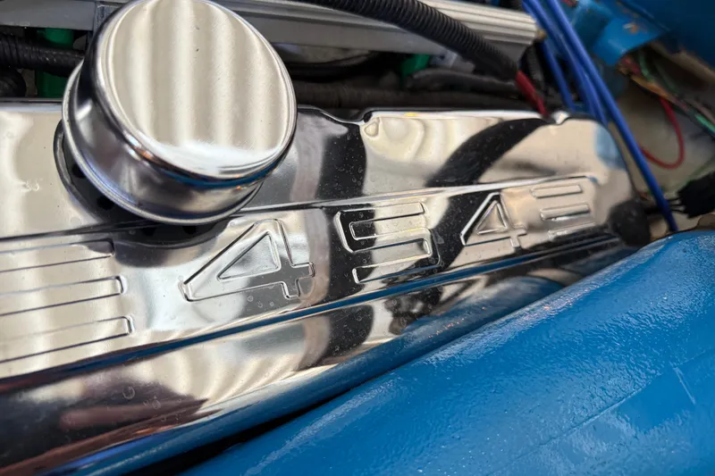 Slide: The Image of Chrome engine cover with "454" engraving on a 1984 Custom 38 model. - 17
