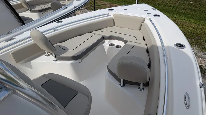 Slide: The Image of 2026 Key West 219 FS boat interior with cushioned seating and cup holders. - 13