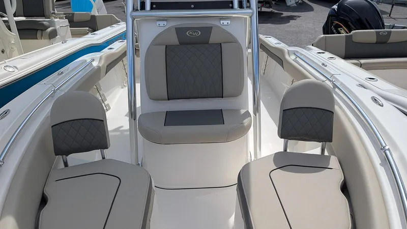 Slide: The Image of 2026 Key West 219 FS boat interior with gray seating and sleek design. - 14