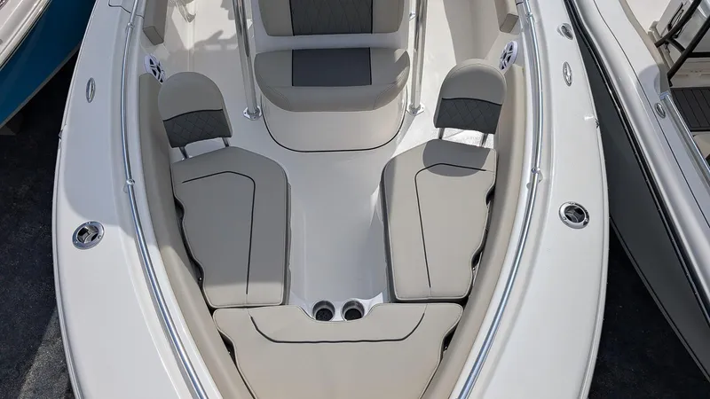Slide: The Image of 2026 Key West 219 FS boat interior with cushioned seating and sleek design. - 15