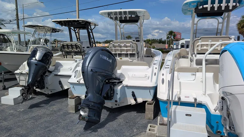 Slide: The Image of 2026 Key West 219 FS boats with Yamaha outboard engines displayed in a marina. - 3