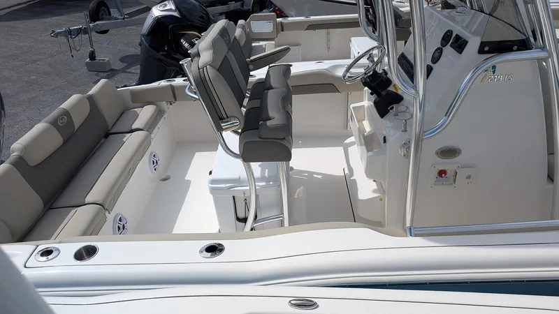 Slide: The Image of 2026 Key West 219 FS boat interior with seating and console, showcasing modern design. - 4