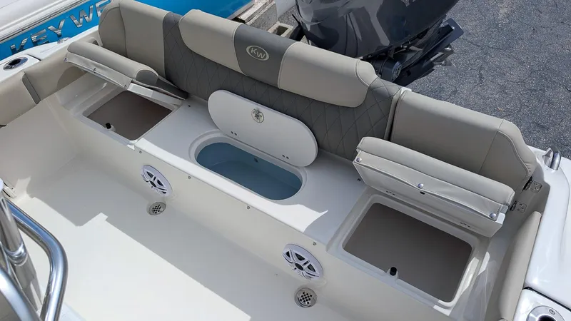 Slide: The Image of 2026 Key West 219 FS boat interior with seating and storage compartments. - 8