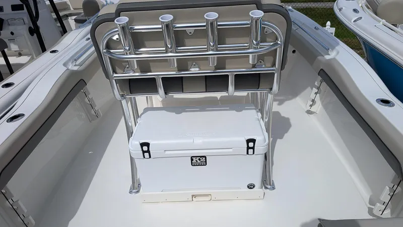 Slide: The Image of 2026 Key West 219 FS boat interior with rod holders and cooler. - 9