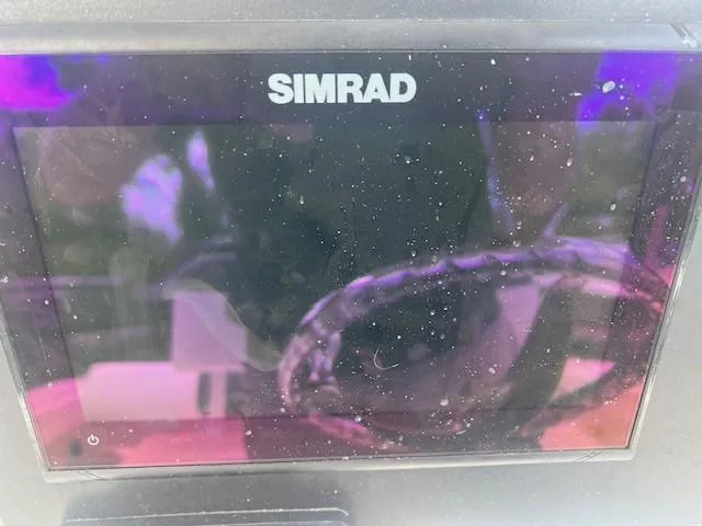 Slide: The Image of Simrad display on 2022 Robalo R222 Center Console boat dashboard. - 12