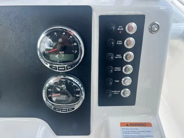 Slide: The Image of Dashboard of 2022 Robalo R222 Center Console with gauges and control switches. - 15