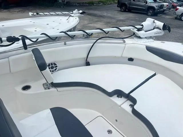 Slide: The Image of 2022 Robalo R222 Center Console boat interior with seating and Garmin equipment. - 19