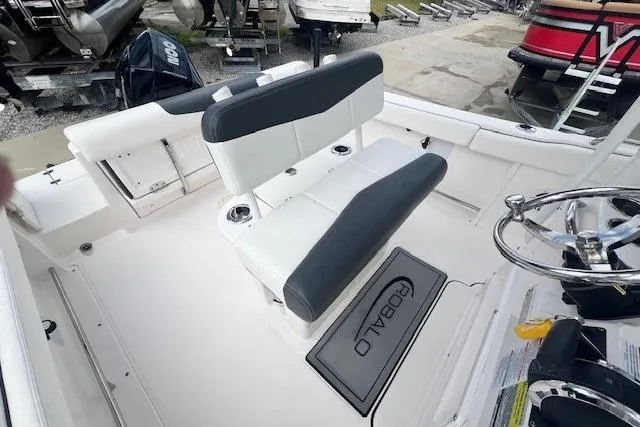 Slide: The Image of 2022 Robalo R222 Center Console boat interior with seating and steering wheel. - 7