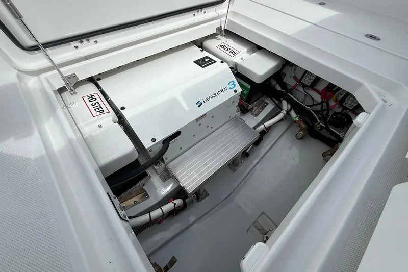 Slide: The Image of 2026 Everglades 375 Center Console engine compartment with Seakeeper 3 stabilizer system. - 13