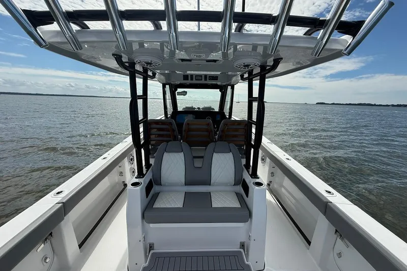 Slide: The Image of 2026 Everglades 375 Center Console boat interior with seating, on open water. - 15