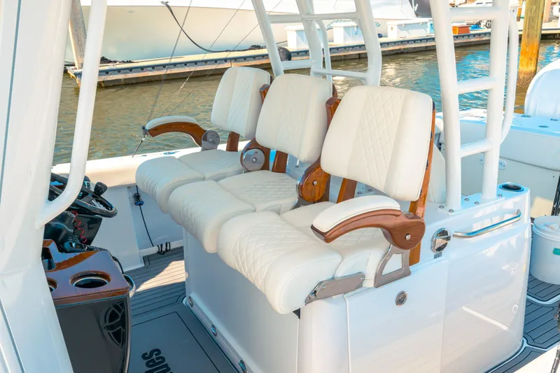 Slide: The Image of 2026 Everglades 375 Center Console boat with triple 350 V6 engines on open water. - 2