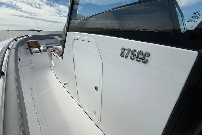 Slide: The Image of 2026 Everglades 375 Center Console boat, sleek design, open deck, ocean backdrop. - 24