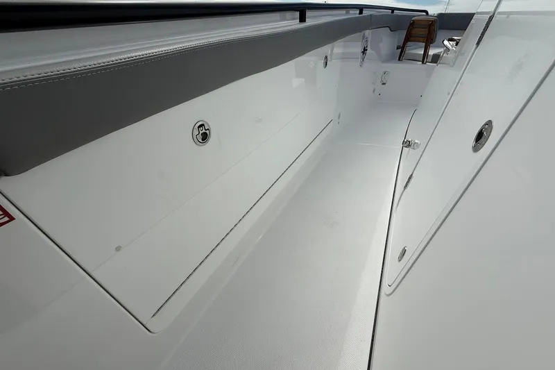 Slide: The Image of 2026 Everglades 375 Center Console boat interior, featuring sleek white design and modern fittings. - 29