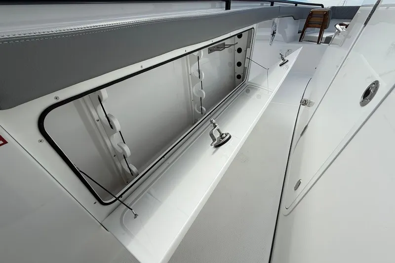 Slide: The Image of 2026 Everglades 375 Center Console boat storage compartment, open and spacious design. - 30