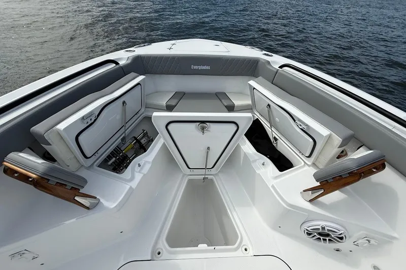 Slide: The Image of 2026 Everglades 375 Center Console boat interior with open storage compartments on the water. - 34