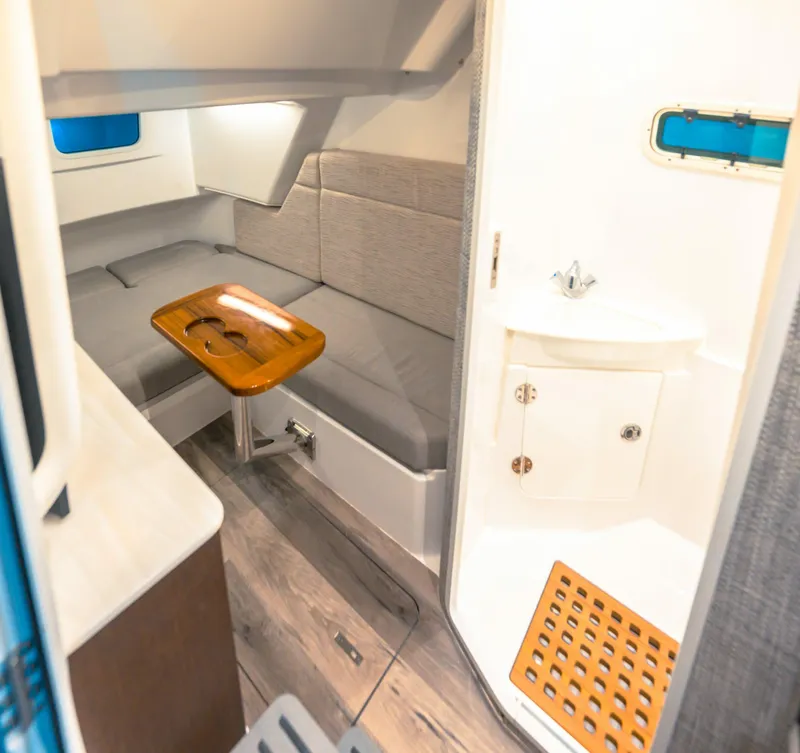 Slide: The Image of 2026 Everglades 375 Center Console boat on calm water under a blue sky. - 4