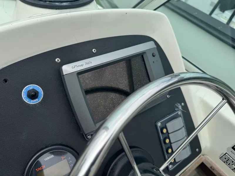 Slide: The Image of 1978 Boston Whaler 21 Outrage dashboard with GPSmap 740s and Yamaha tachometer. - 18