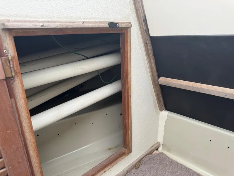 Slide: The Image of Interior view of a 1978 Boston Whaler 21 Outrage boat storage compartment. - 23