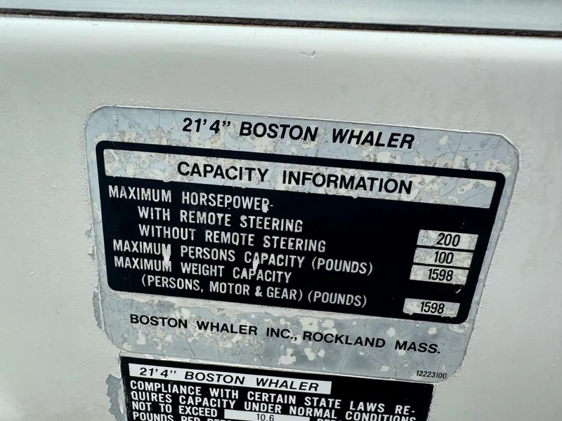 Slide: The Image of Capacity information label on a 1978 Boston Whaler 21 Outrage boat. - 24