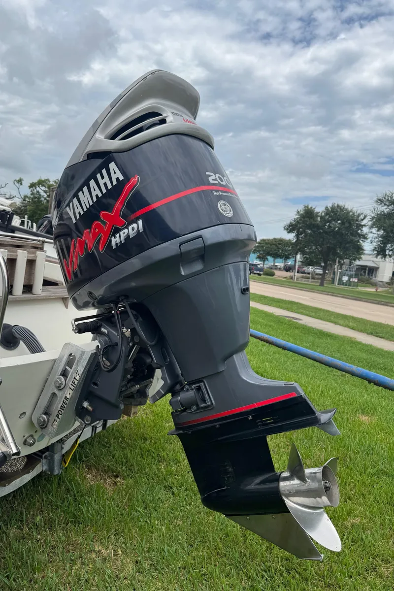Slide: The Image of Yamaha VMAX HPDI outboard motor on a 1978 Boston Whaler 21 Outrage boat. - 27