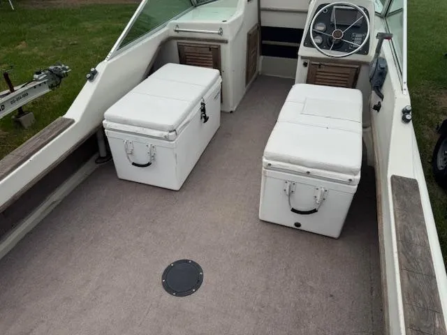 Slide: The Image of 1978 Boston Whaler 21 Outrage interior with seating and steering wheel. - 9