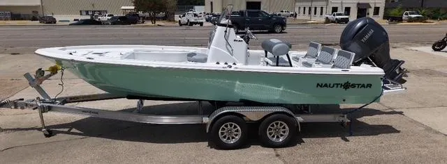The Image of 2026 NauticStar 214 Bay boat on trailer, parked outdoors. - 0