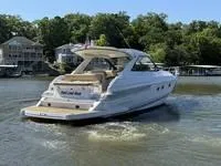 Slide: The Image of Dashboard of a 2010 Regal 46 Sport Coupe with navigation and control screens. - 12