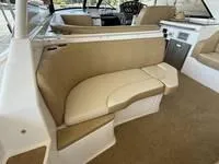 Slide: The Image of 2010 Regal 46 Sport Coupe yacht docked on calm water. - 18