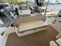 Slide: The Image of 2010 Regal 46 Sport Coupe yacht docked on a serene lake. - 19