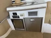 Slide: The Image of Interior cabin of 2010 Regal 46 Sport Coupe with twin beds and cozy decor. - 22