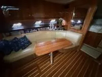 Slide: The Image of Interior of 2010 Regal 46 Sport Coupe with wood paneling and mounted TV. - 28