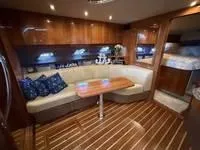 Slide: The Image of Luxurious cabin interior of 2010 Regal 46 Sport Coupe yacht with elegant wood finish. - 29