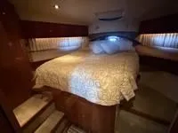 Slide: The Image of Bathroom interior of 2010 Regal 46 Sport Coupe yacht, featuring sink and toilet. - 30