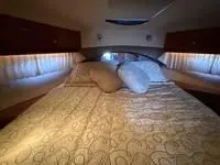 Slide: The Image of Bathroom interior of 2010 Regal 46 Sport Coupe yacht, featuring sink, toilet, and shower. - 31