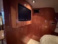 Slide: The Image of Luxurious interior of 2010 Regal 46 Sport Coupe with elegant seating and wooden table. - 35