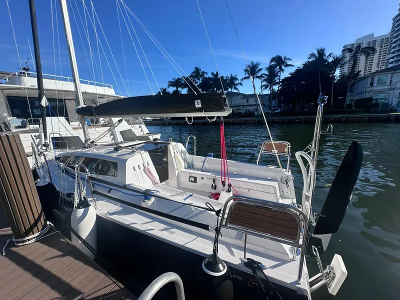 Slide: The Image of Modern Maxus 26 sailboat docked by palm trees, 2025 model, sunny day. - 11