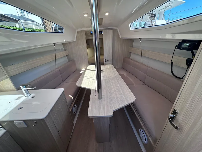 Slide: The Image of Interior of 2025 Maxus 26 sailboat with modern seating and wooden finishes. - 14
