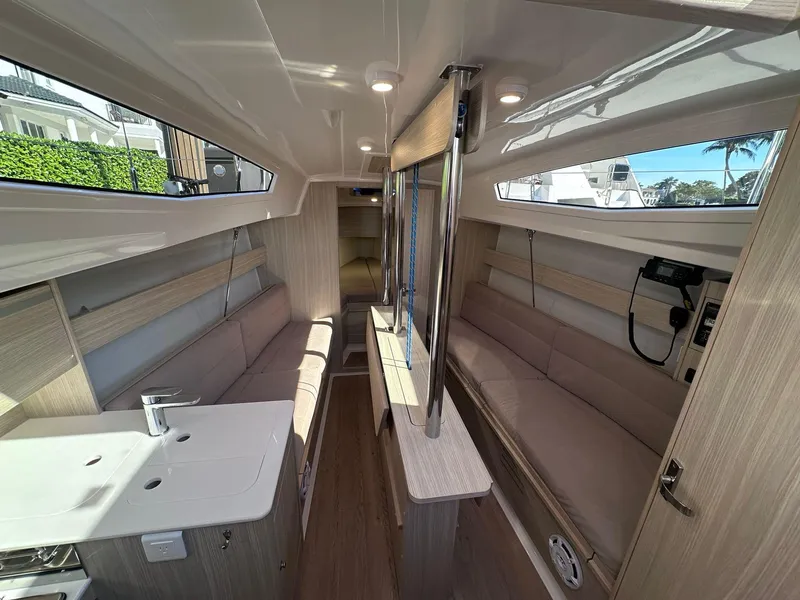 Slide: The Image of Interior of 2025 Maxus 26 yacht, featuring modern seating and sleek design elements. - 16