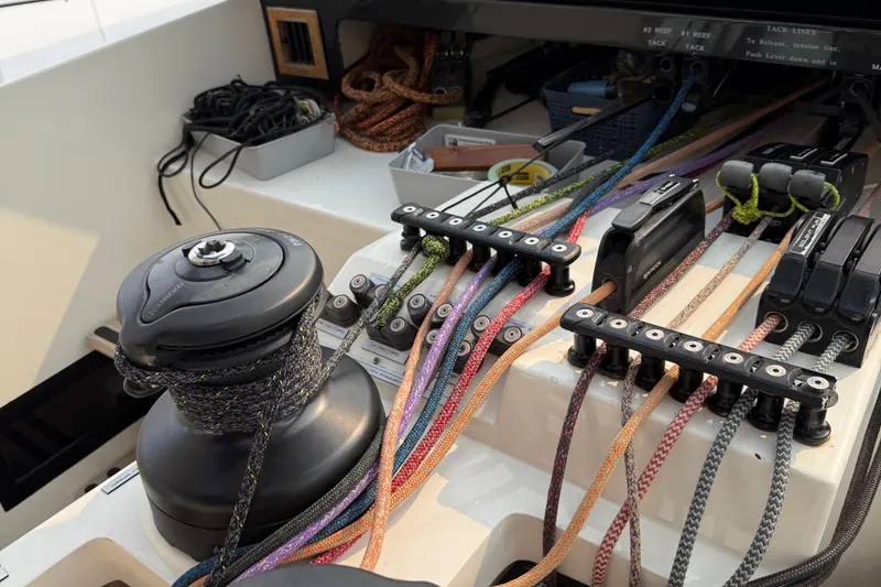 Slide: The Image of Sailing yacht control panel with colorful ropes, winch, and cleats on a 2015 Gunboat 57'. - 10