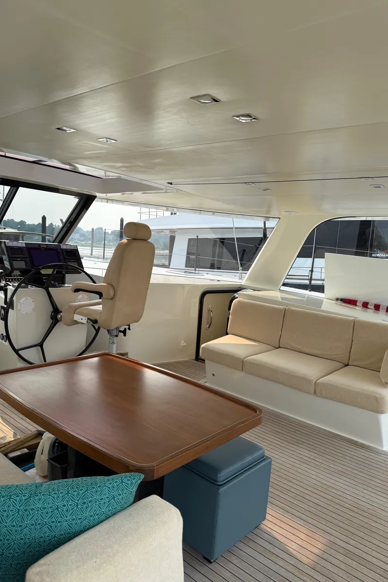 Slide: The Image of Interior of 2015 Gunboat 57' yacht with helm, seating, and table. - 12