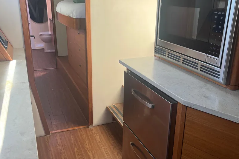 Slide: The Image of Interior of 2015 Gunboat 57' yacht with modern kitchen and hallway view. - 15