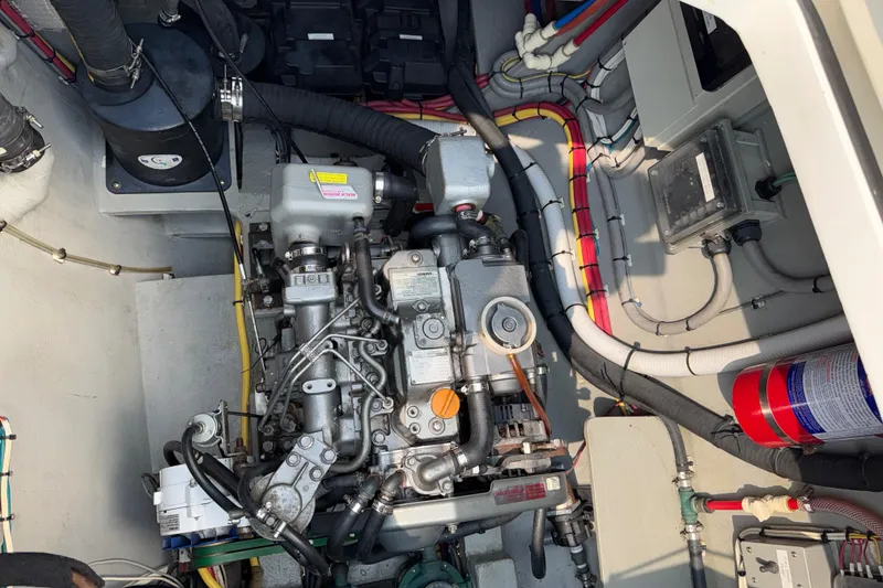 Slide: The Image of Engine compartment of a 2015 Gunboat 57' yacht, showcasing detailed mechanical components. - 28
