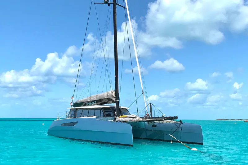 Slide: The Image of 2015 Gunboat 57' catamaran sailing on clear turquoise waters under a blue sky. - 3